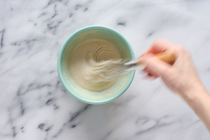 Whisking together the frosting ingredients. 