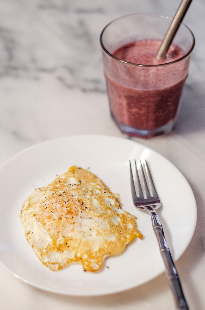 Breakfast: a fried egg and a cherry smoothie.