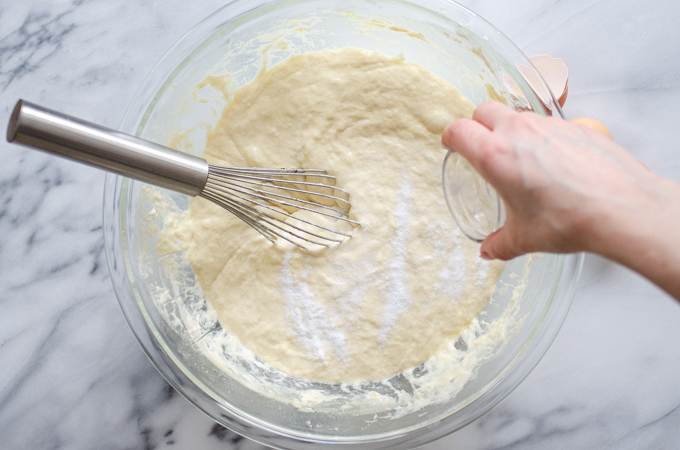 Sprinkling the baking soda on top of the batter.