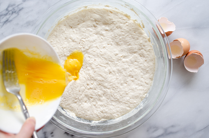 Pouring the eggs into the fermented batter.