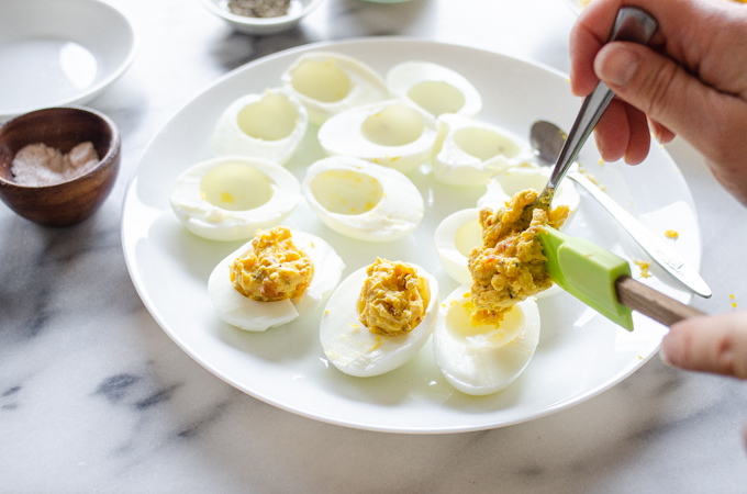 Filling the deviled eggs.