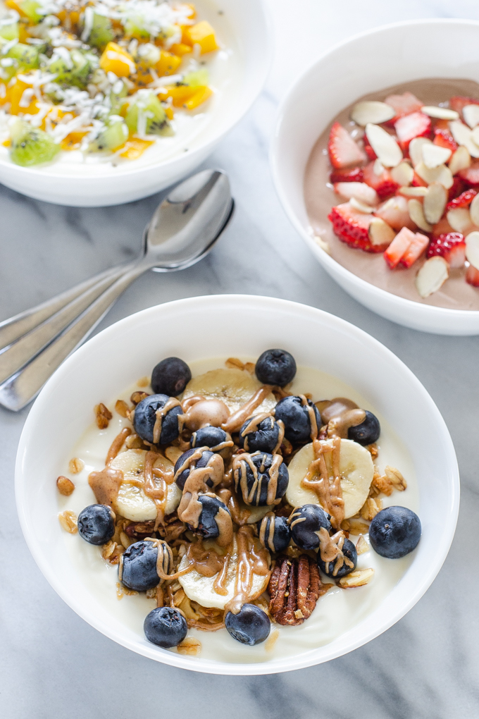 Three ideas for yogurt bowls: granola, chocolate, and tropical!