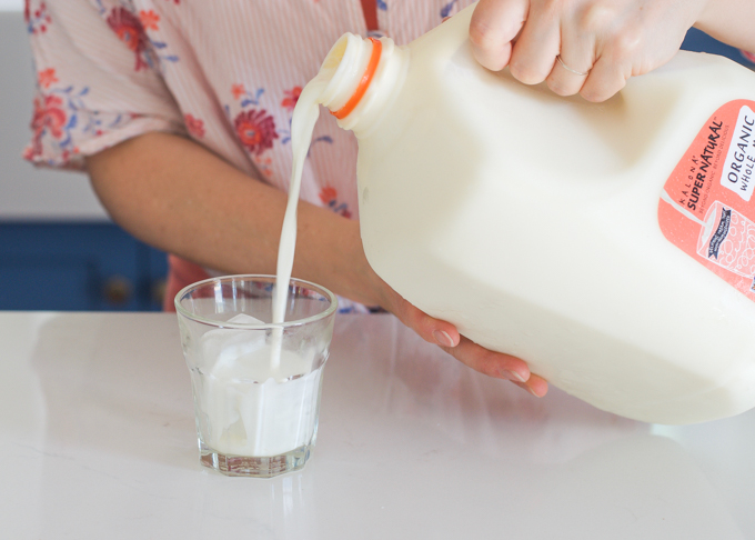 Pouring milk into a glass.