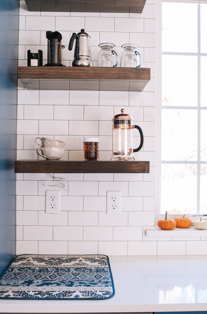 Open shelving coffee station in a transitional modern farmhouse kitchen.