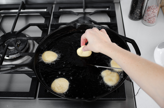 Frying the sourdough donut holes.