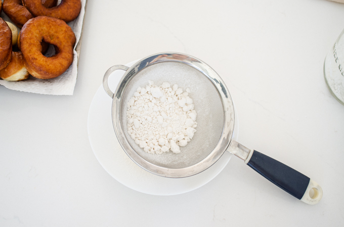 Sifting the powdered sugar for the frosting.