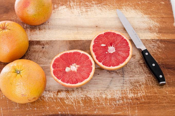 How to eat a grapefruit with a spoon: start by slicing it in half.