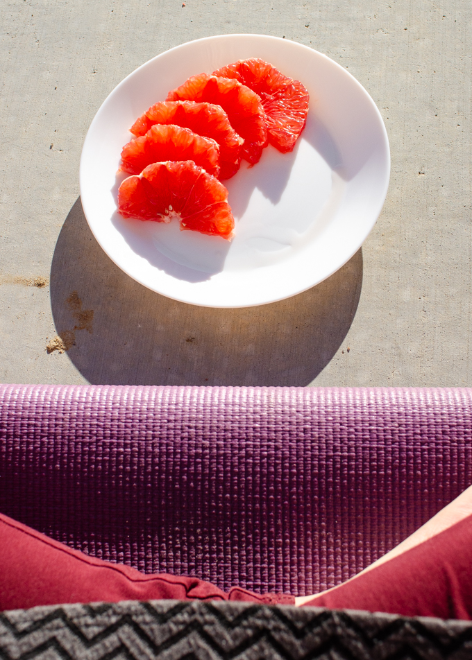 Eating an afternoon snack of grapefruit on a sunny porch.