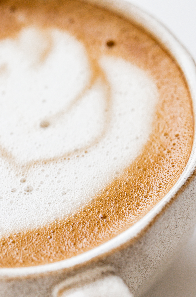 Close up shot of an oat milk latte